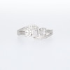 0.25 CT. T.W. Oval-Shaped Multi-Diamond Frame Bypass Three Stone Ring in 10K White Gold
