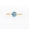 6.0mm Swiss Blue Topaz Solitaire Bypass Ring in 10K Gold