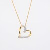 0.25 CT. T.W. Diamond Double Row Tilted Heart Pendant in 10K Gold