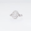0.50 CT. T.W. Oval-Shaped Multi-Diamond Swirl Frame Twist Shank Ring in Sterling Silver